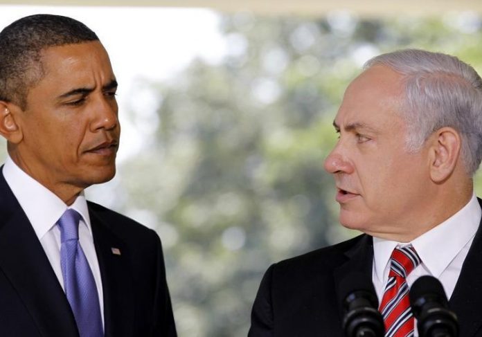 US President Obama listens as Israeli PM Netanyahu delivers a statement in Washington